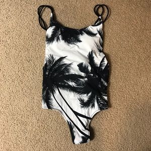Island feel black and white one piece w/ low back